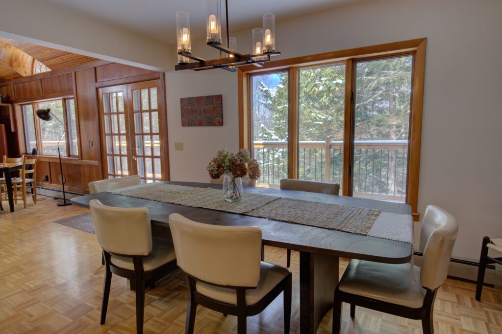 dining room, chairs, exterior door, window, chandelier, dining table